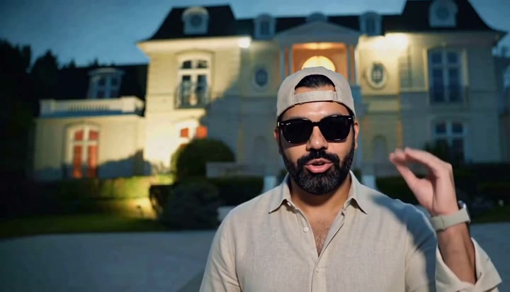Mansion at dusk with supercars recast video still