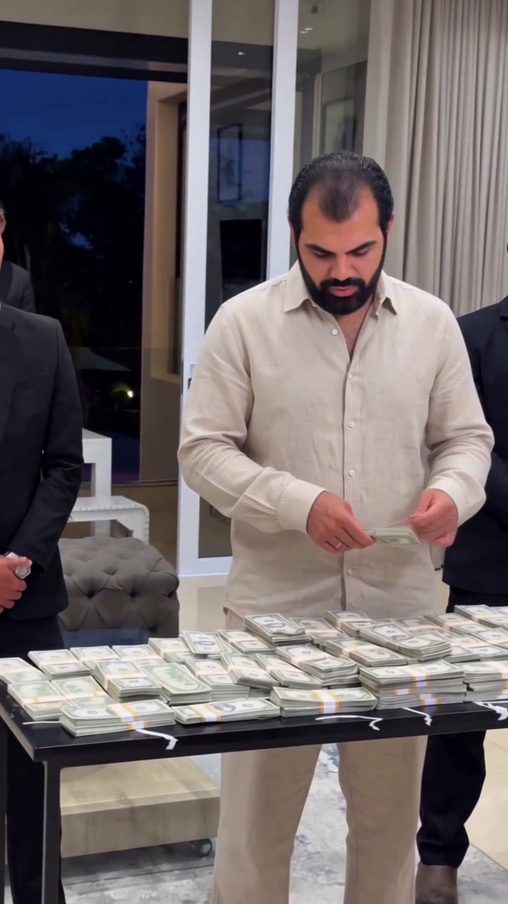 Counting cash with bodyguards recast video still
